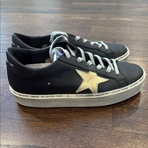 Golden Goose Black and Gold Sneakers with Star Design